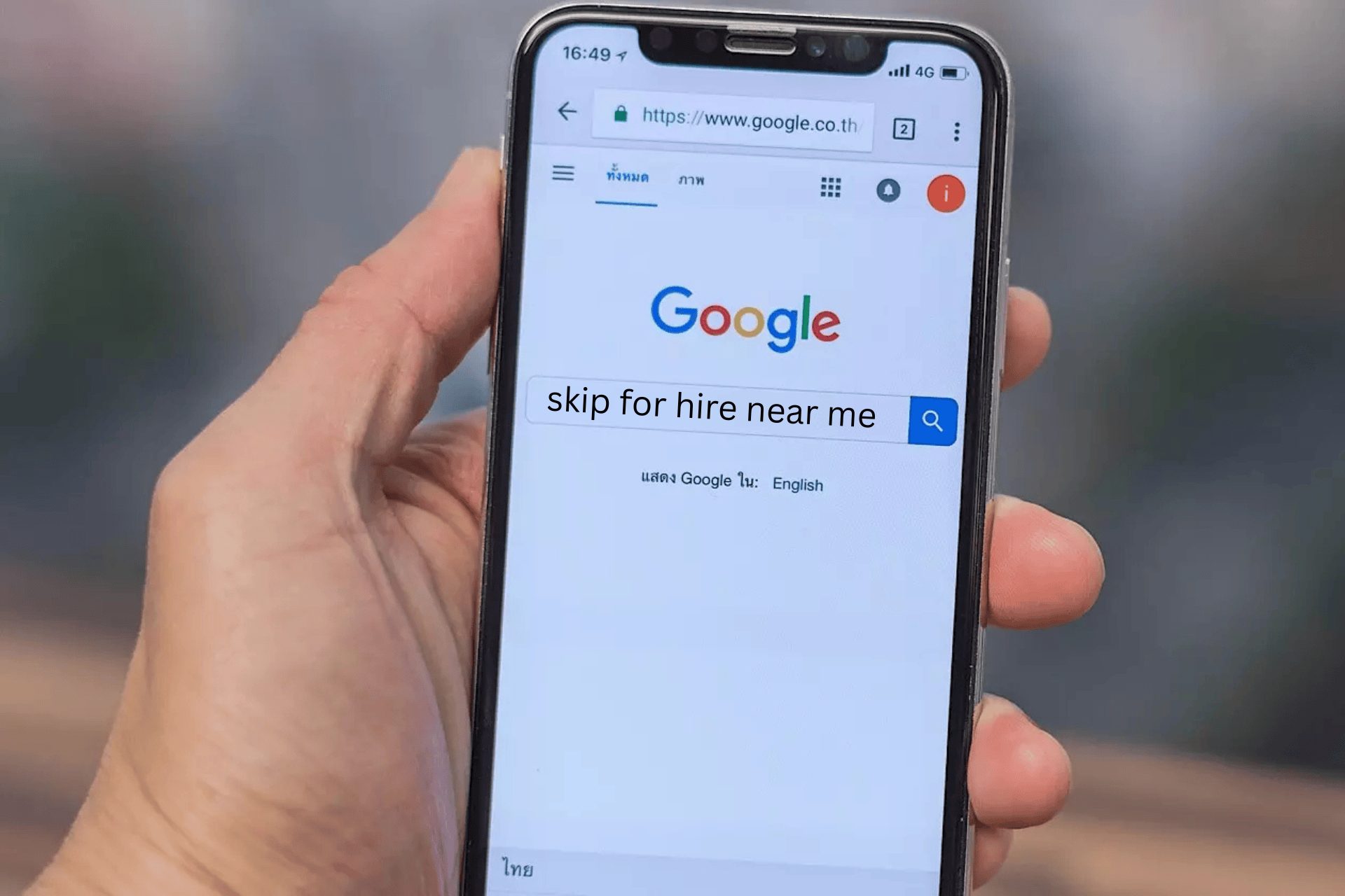 Someone searching skip for hire near me on Google on their mobile phone