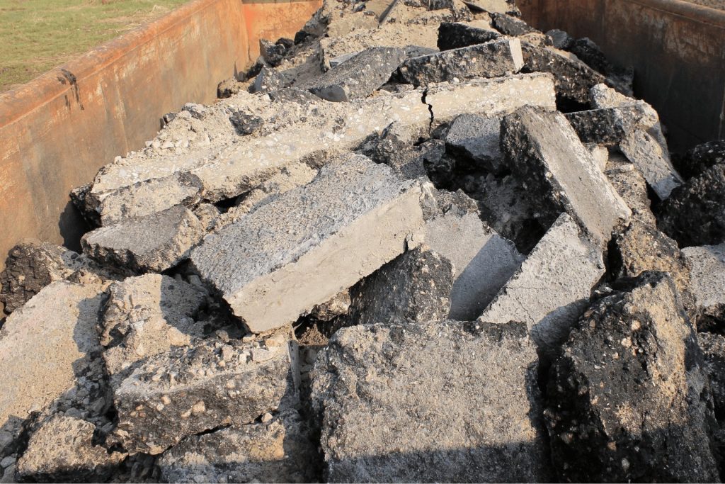 A photo of a skip hire that is full of rubble